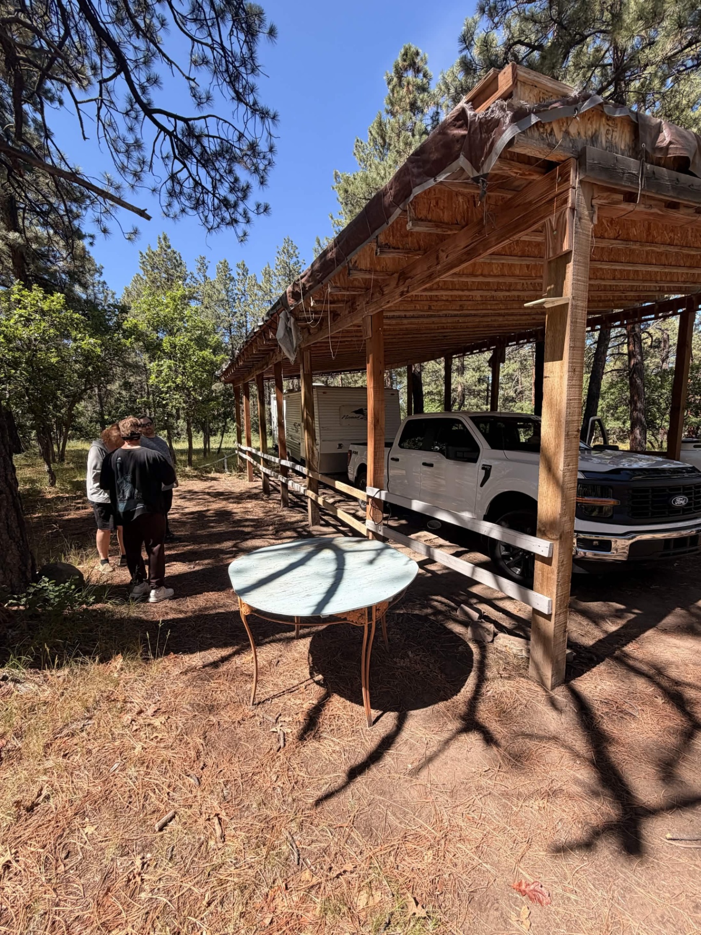 After: cleared site with truck and crew on the property